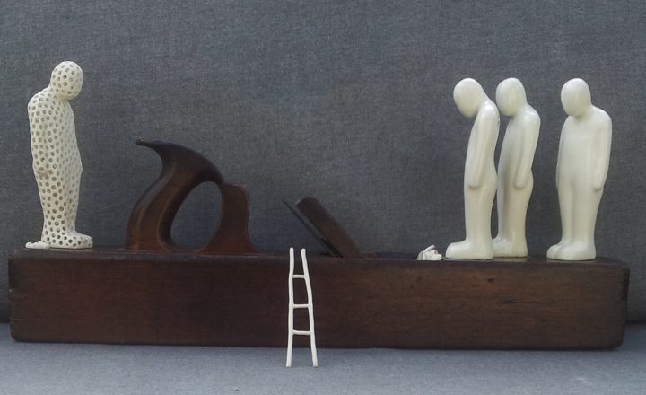 Old Wooden Plane on Four Figures