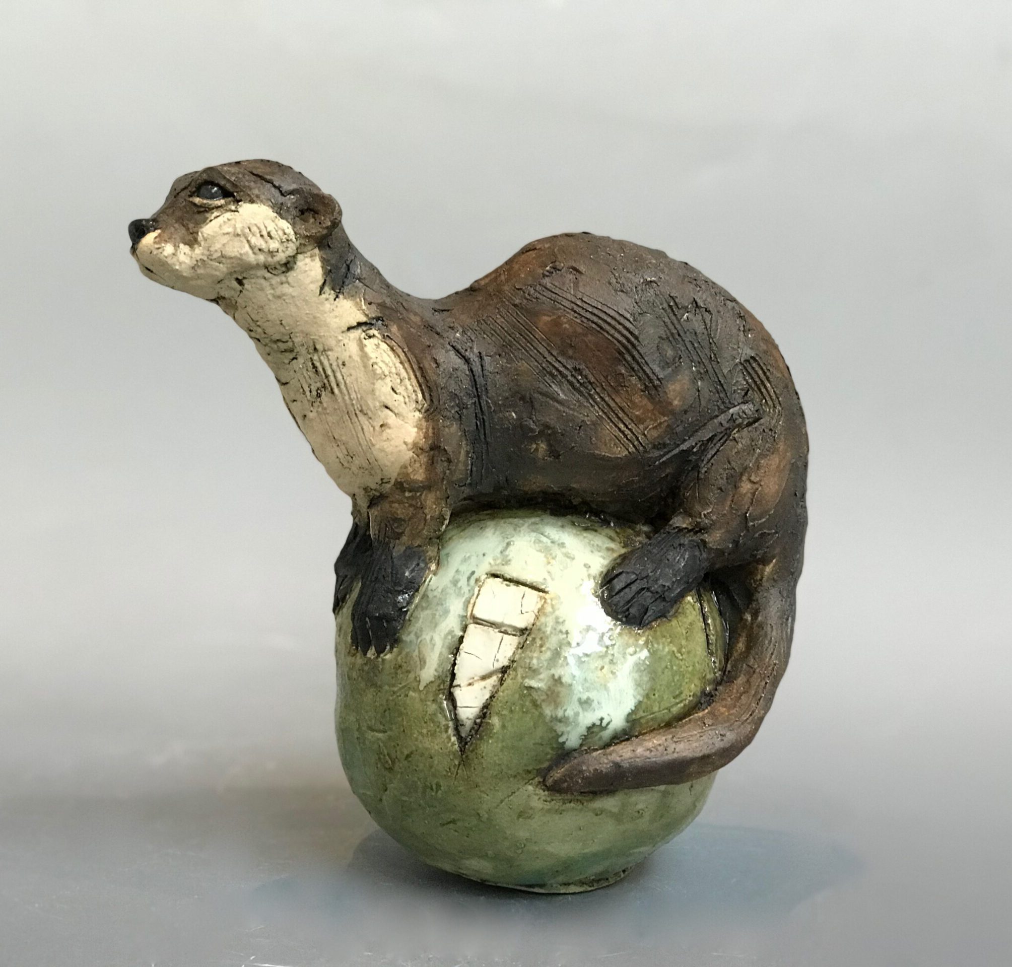 Otter on Coloured Sphere